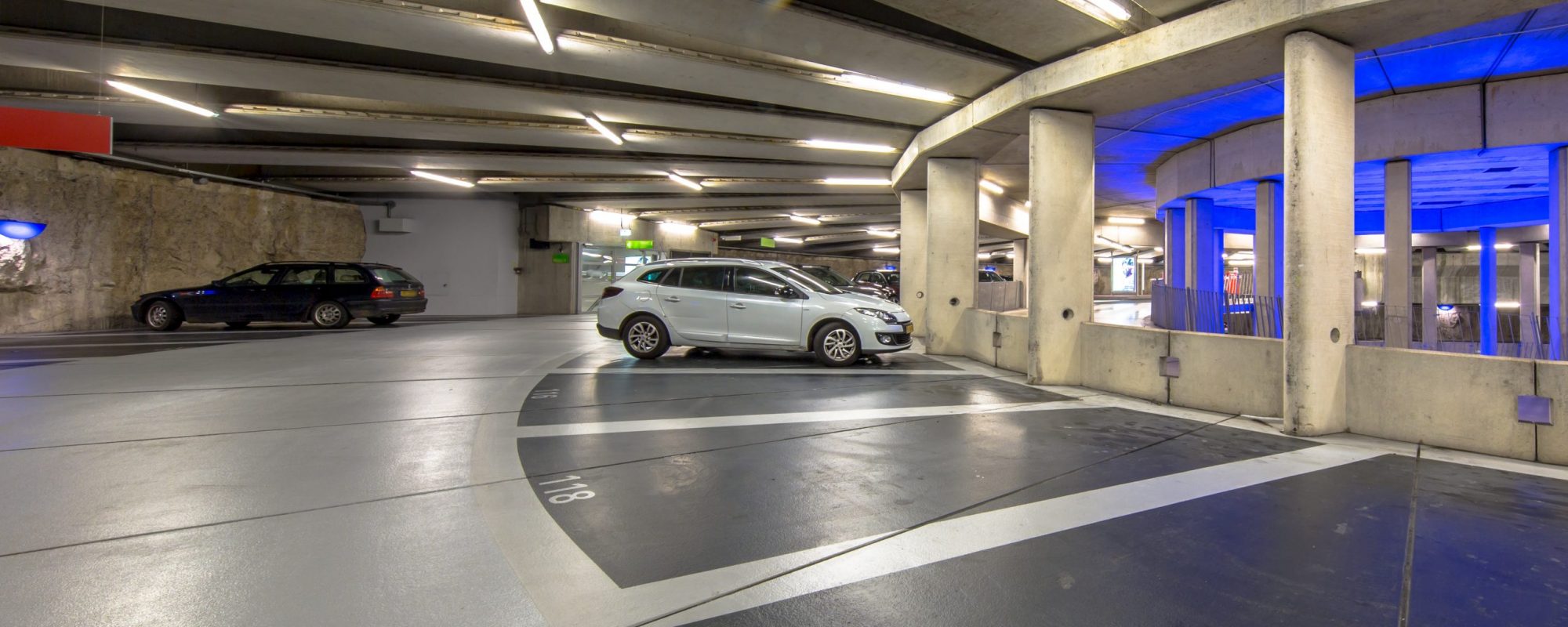 Modern Underground circular parking garage with parked cars